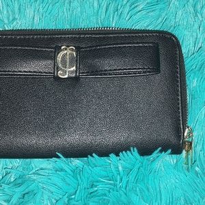 Gently used juicy couture wallet !  Black with silver.